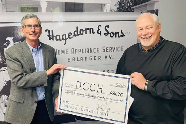 Bob Wilson receives donation from Hagedorn's