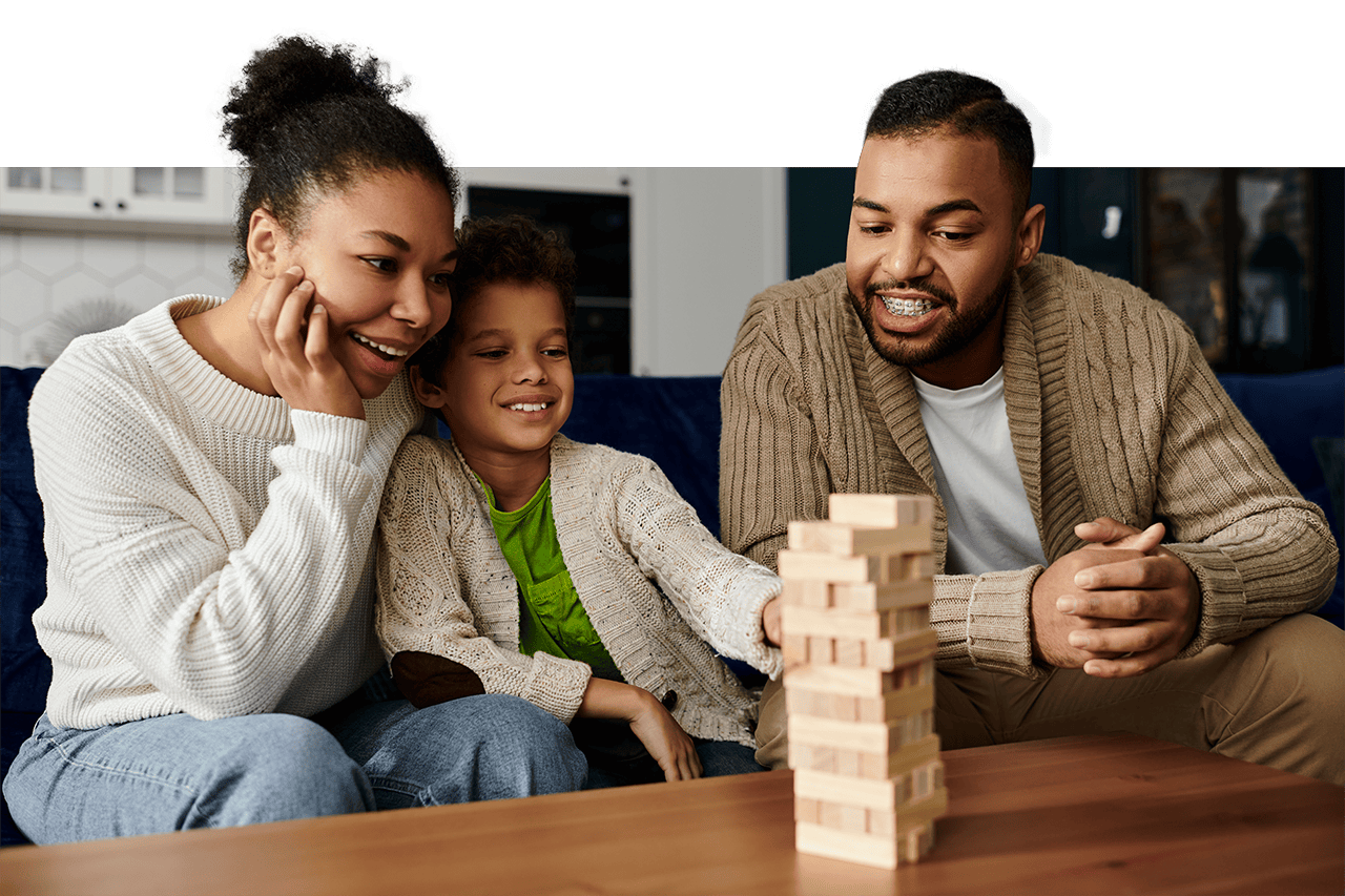 Therapeutic Foster Care - young family playing jenga